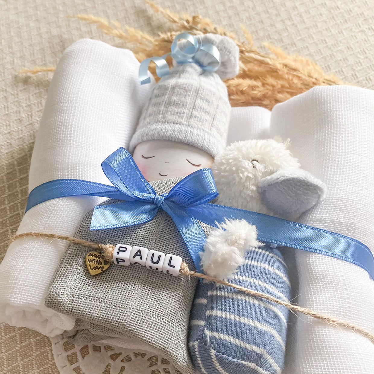 moments Windelbaby mit Minirassel Gans blau zur Geburt