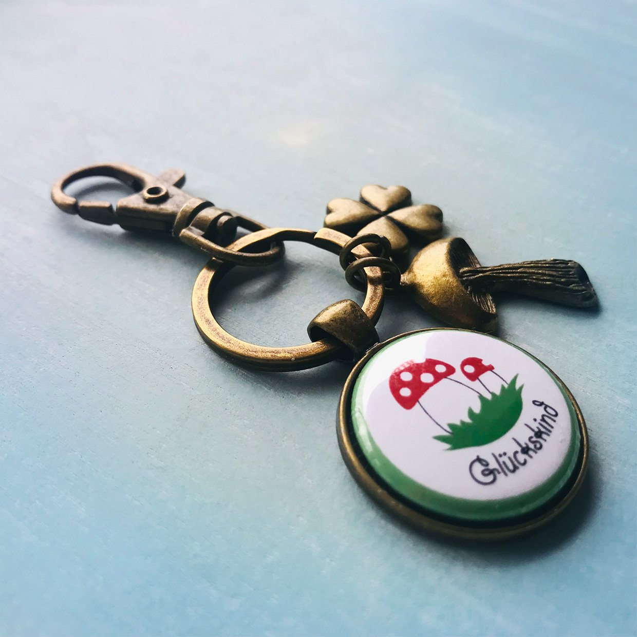 Schlüsselanhänger Glück Glückspilz antikgold